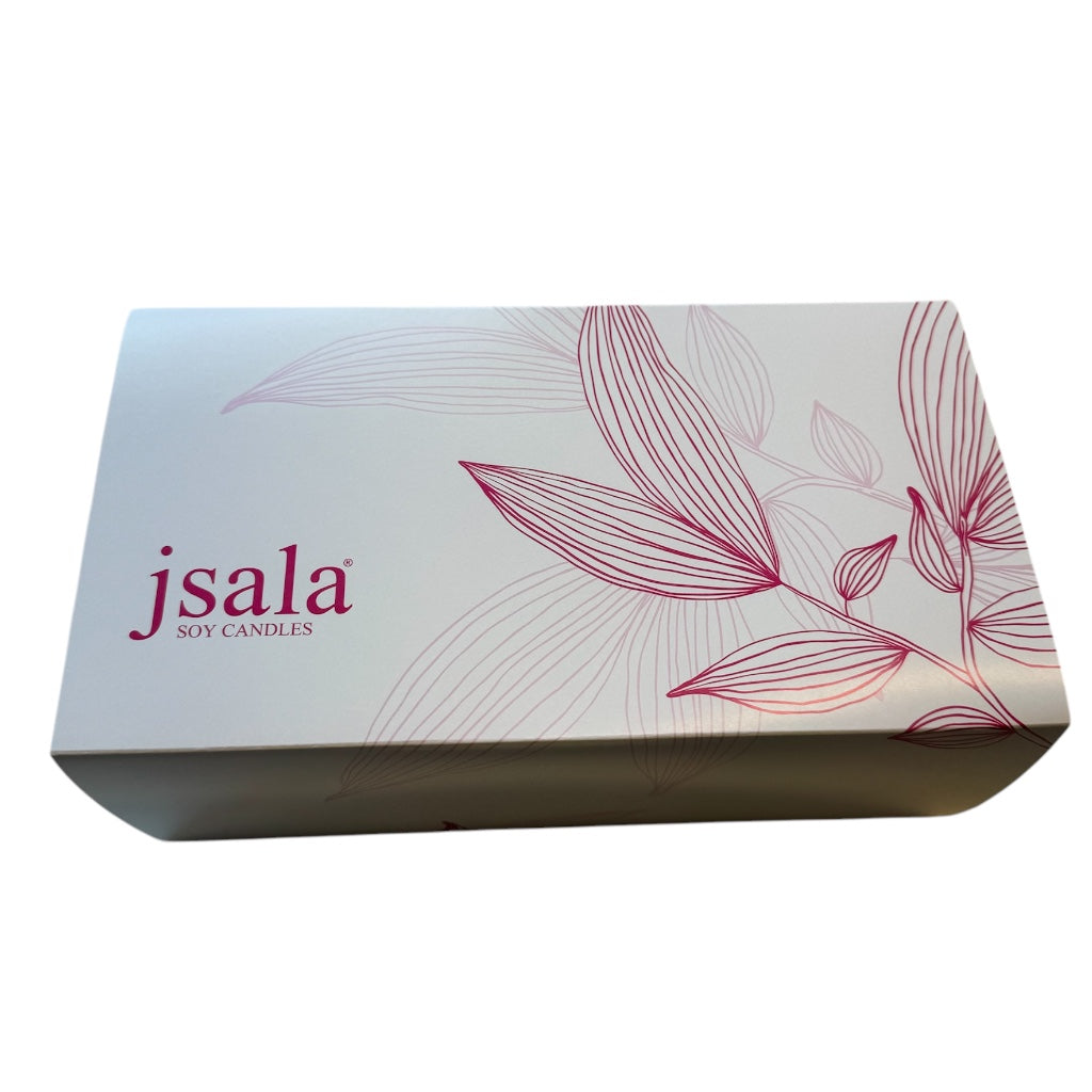 Mother’s Day gift box with a white soy candle labelled “Mum – Happy Mother’s Day”, a 100ml JSALA room spray, a personalised white face washer with the name and a flower-shaped soap in Peony Blush scent, all neatly packed in a white gift box with shredded paper filling.