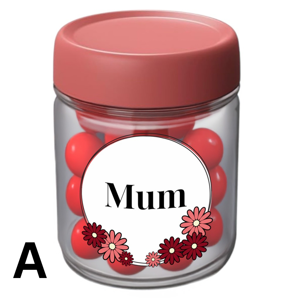 Clear gift jar with pink lid, filled with red treats, featuring a white floral label that says ‘Mum’ – perfect for Mother’s Day or gift giving.