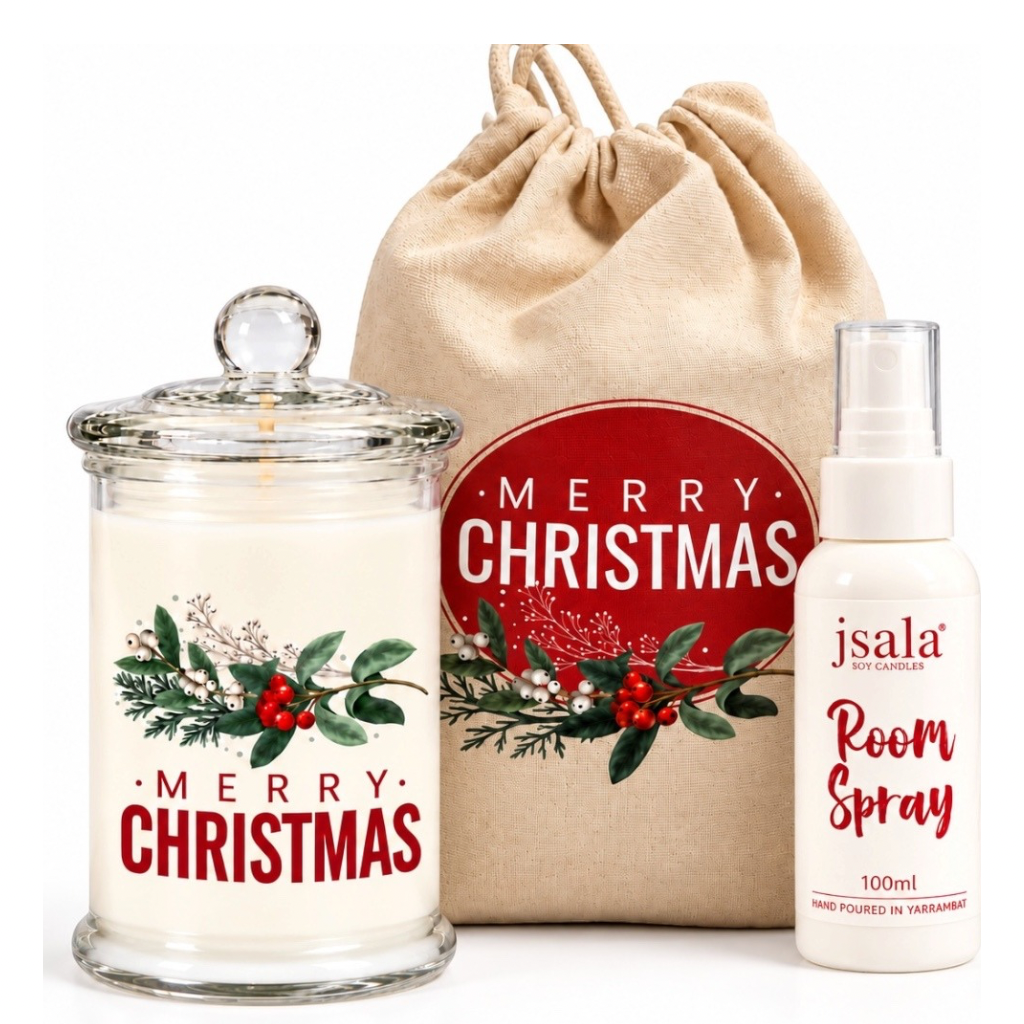 A medium candle with 100ml room spray Christmas gift bag.