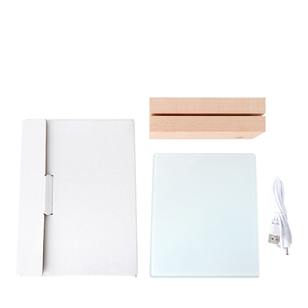 A natural beechwood LED base, featuring a transparent square glass sheet ready for custom printing, ideal for displaying photos or messages. The package