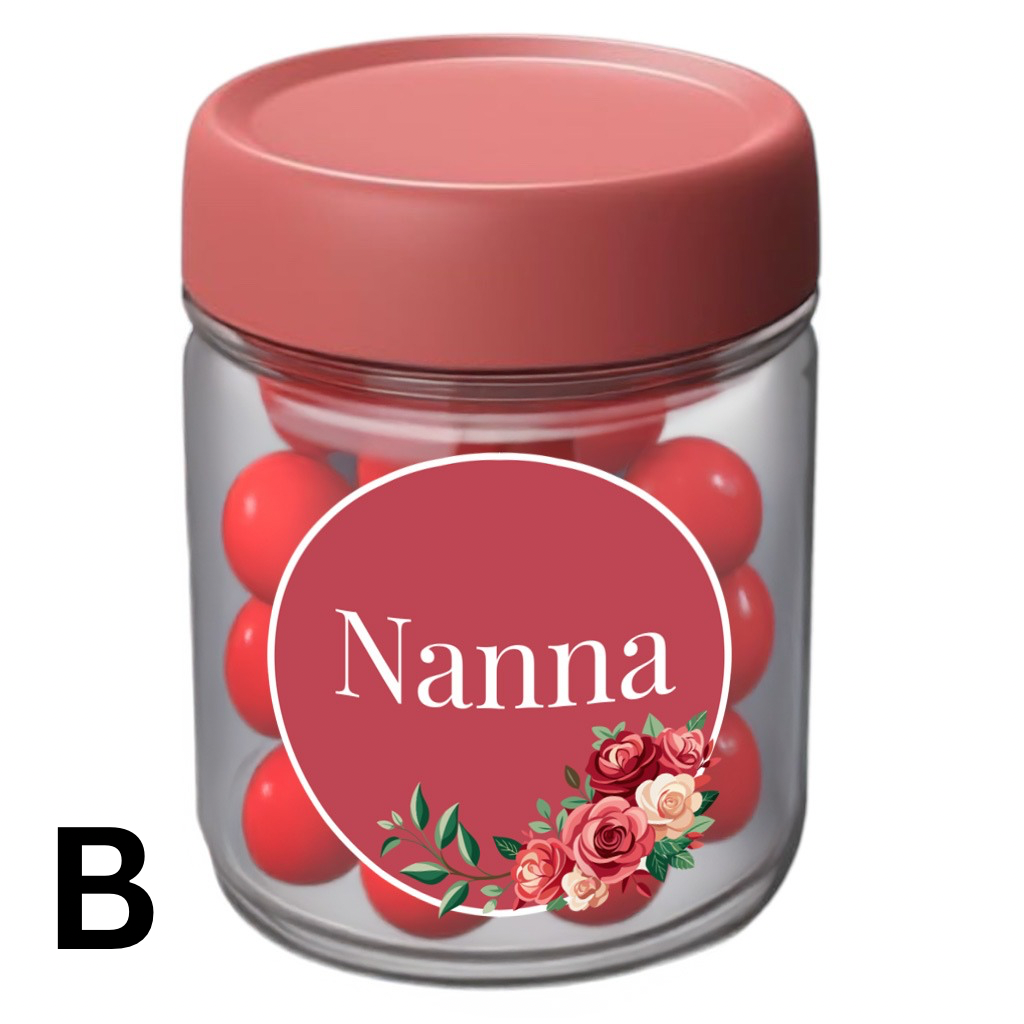Clear gift jar with pink lid, filled with red treats, featuring a rosy red floral label that says ‘Nanna’ – ideal for Mother’s Day or special occasions.