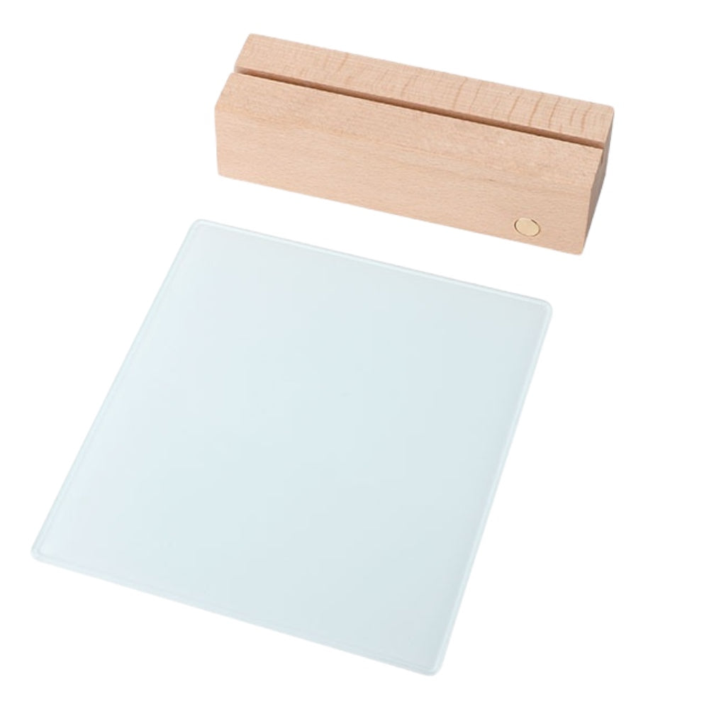 A natural beechwood LED base, featuring a transparent square glass sheet ready for custom printing, ideal for displaying photos or messages.