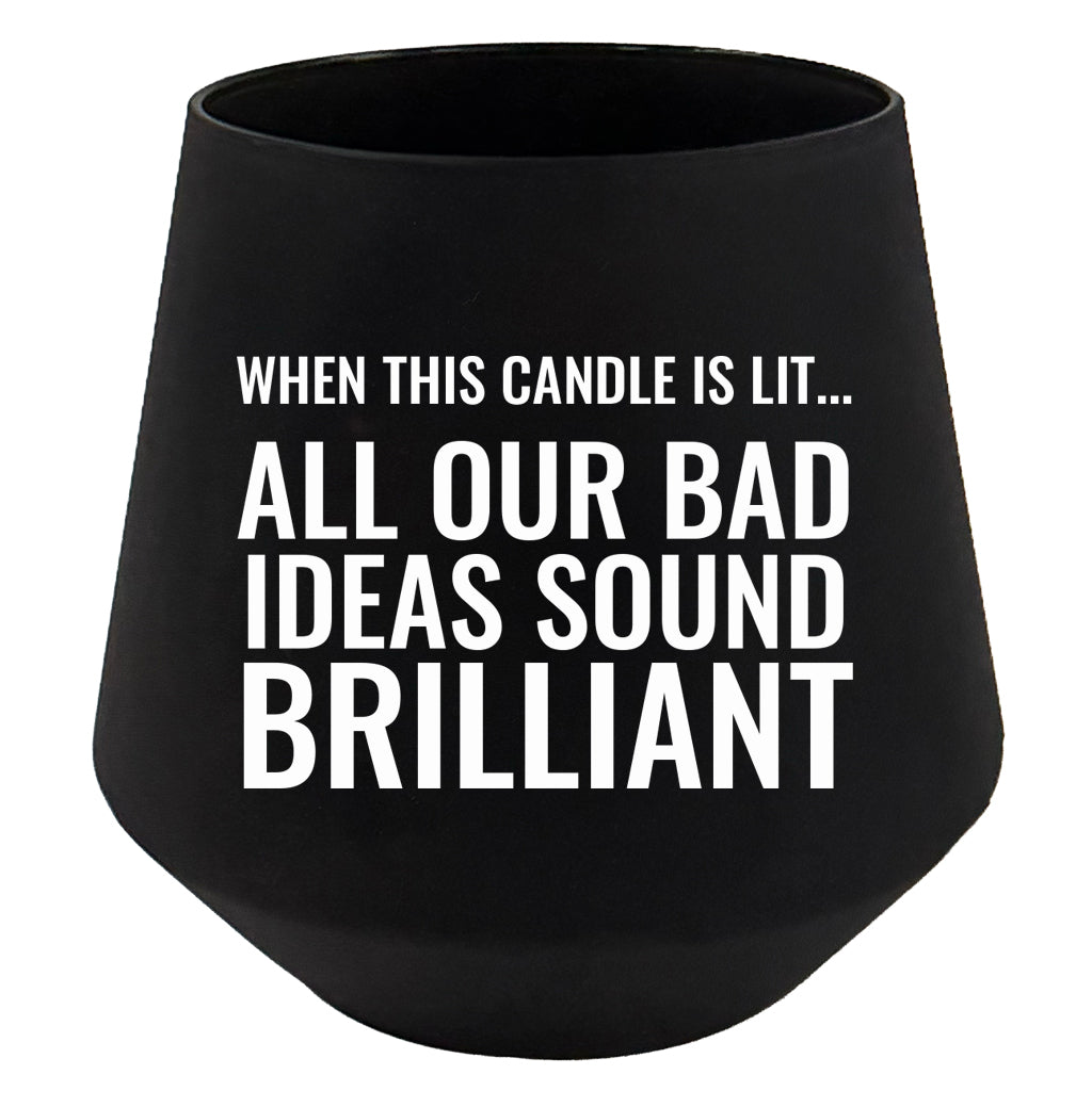 Black candle holder with humorous text on a white background