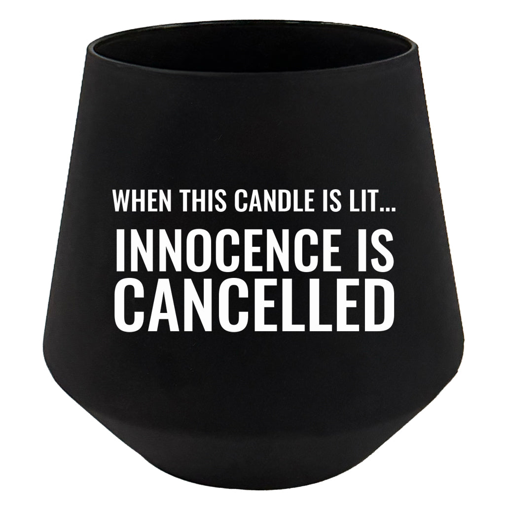 Black candle holder with humorous text on a white background