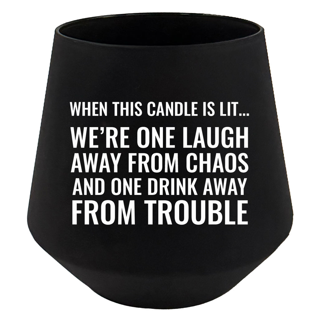 Black candle holder with humorous text on a white background