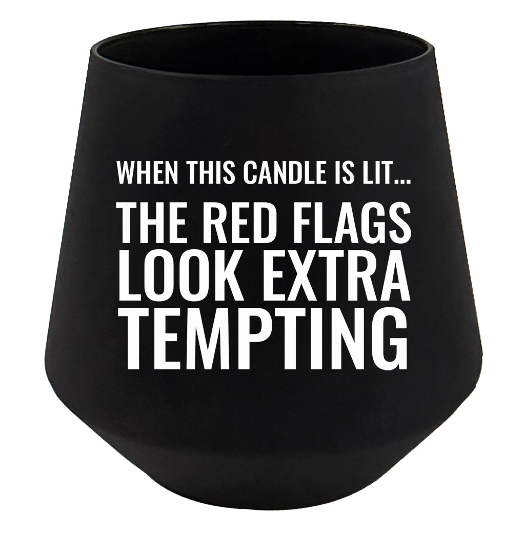 Black candle holder with humorous text on a white background