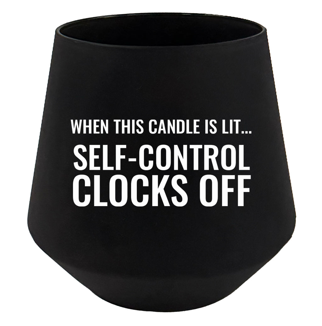 Black candle with humorous text on a white background