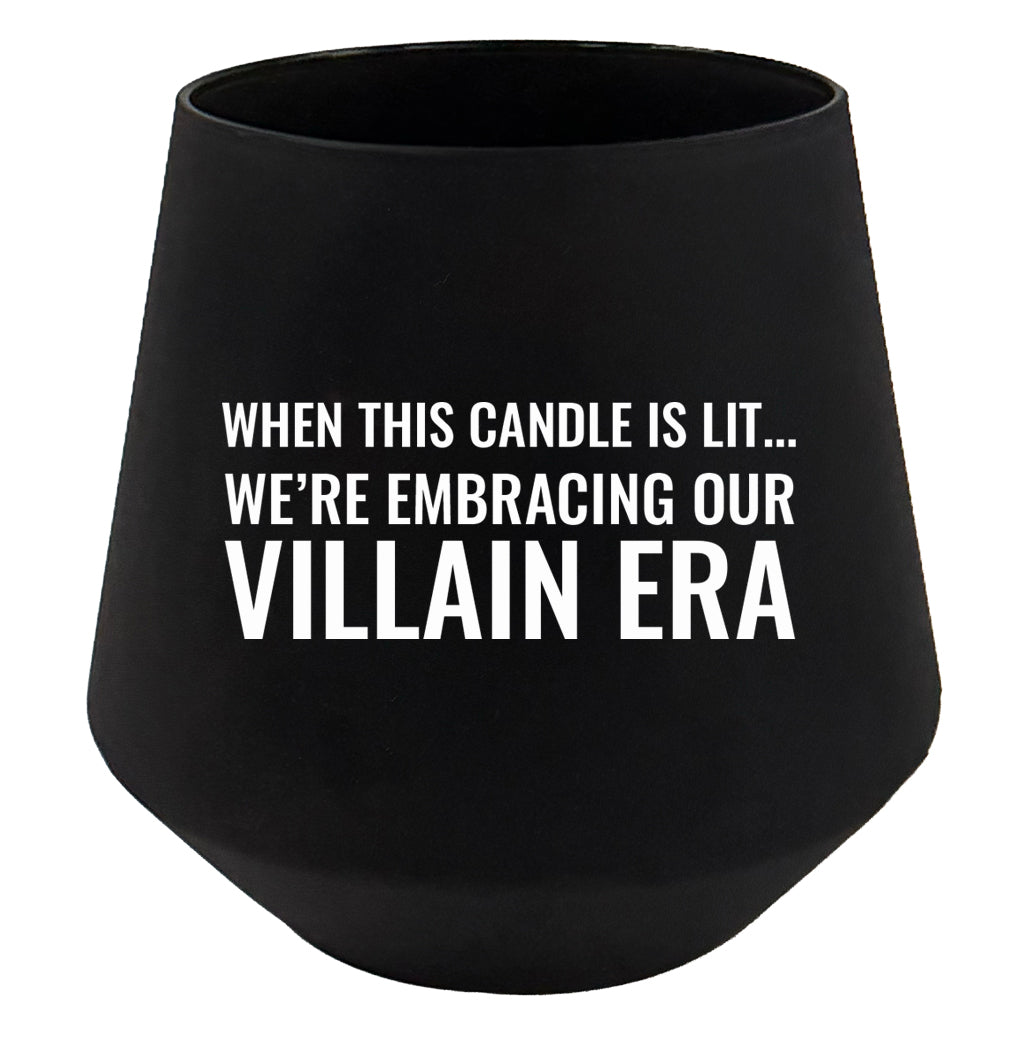 Black candle holder with humorous text on a white background