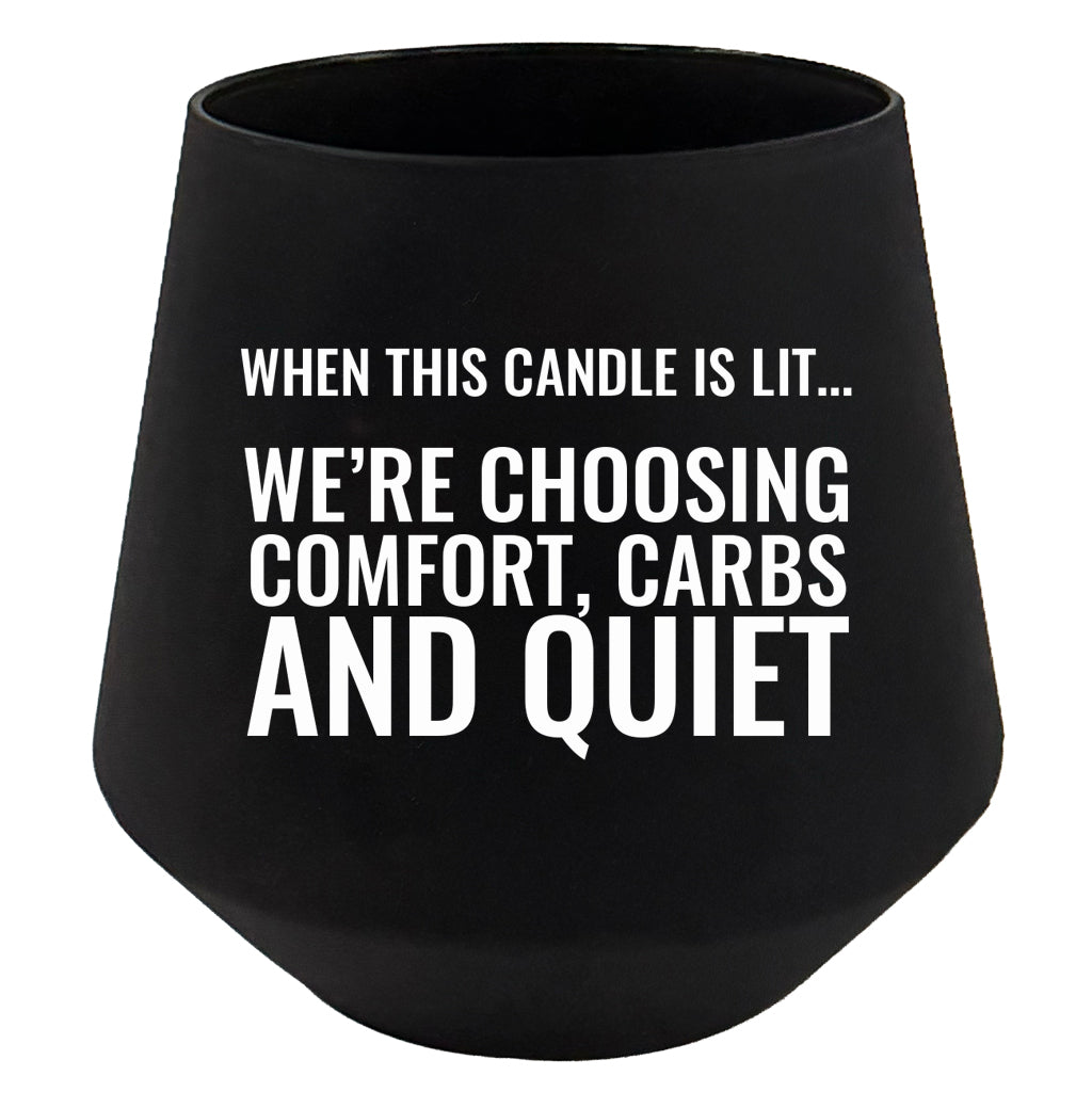 Black candle holder with white text on a white background