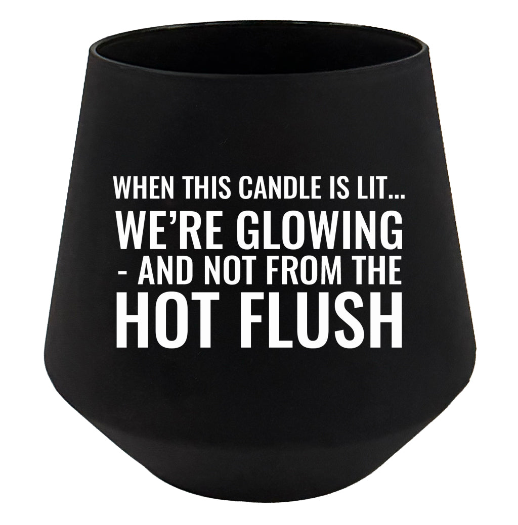 Black candle holder with humorous text on a white background