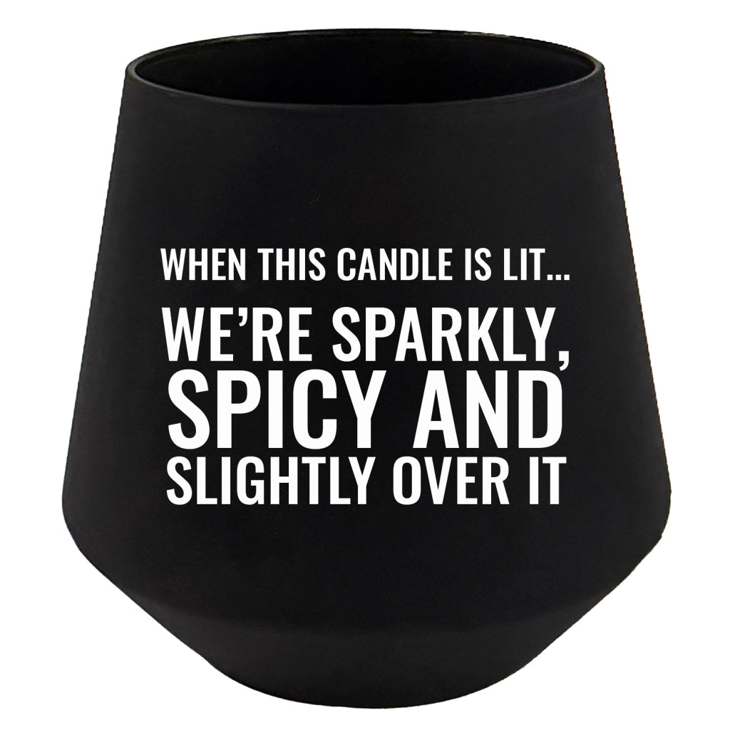 Black candle holder with humorous text on a white background