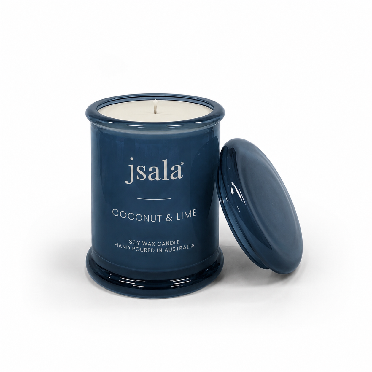 Blue candle jar with 'jsala' branding and 'Coconut & Lime' description on a white background
