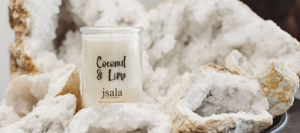 Jsala Apothecary Candle sitting in a large white cystal