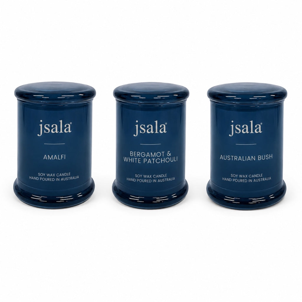 Three blue candles labeled 'jsala' on a white background