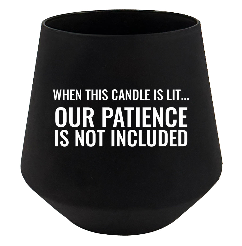 Black candle holder with humorous text on a white background