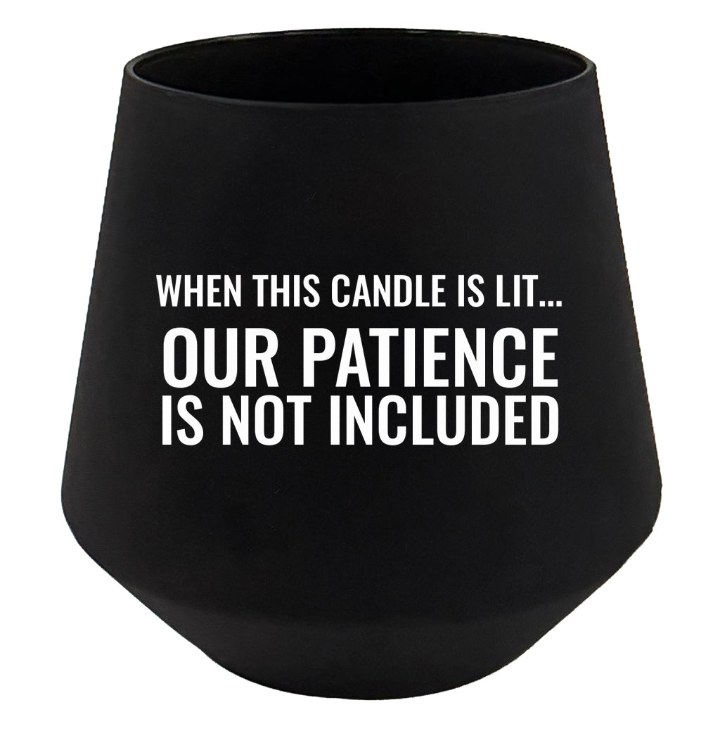 Black candle holder with humorous text on a white background