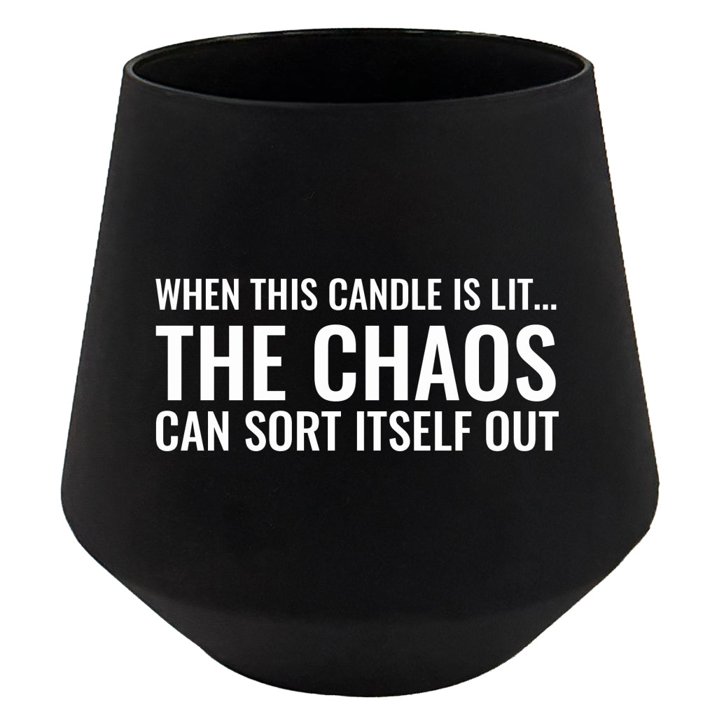 Black candle holder with humorous text on a white background