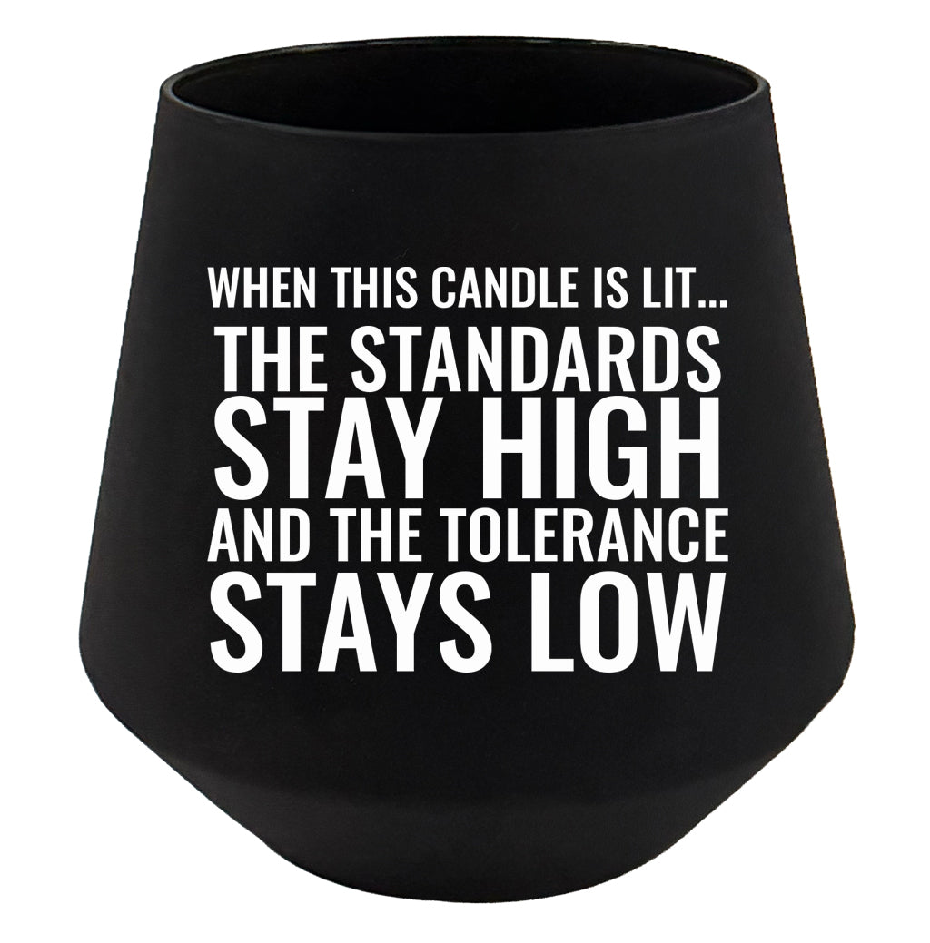 Black candle holder with white text on a white background