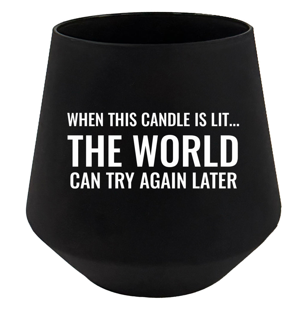 Black candle holder with humorous text on a white background
