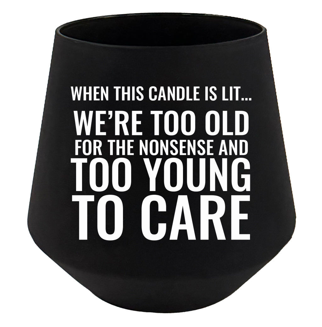 Black candle holder with white text on a white background