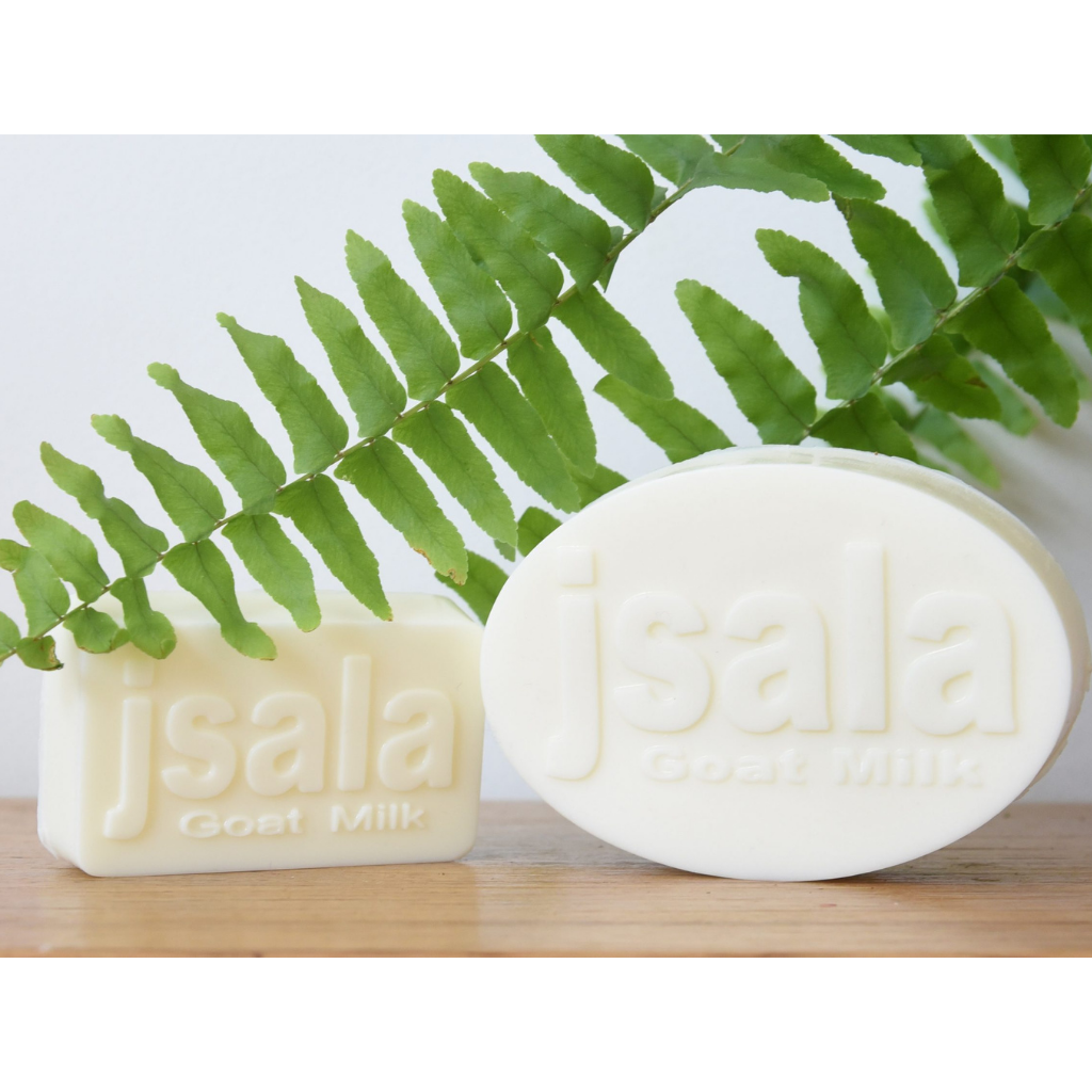 Unscented Guest Soap (65gm) by Jsala Soy Candles next to normal size goats milk soap
