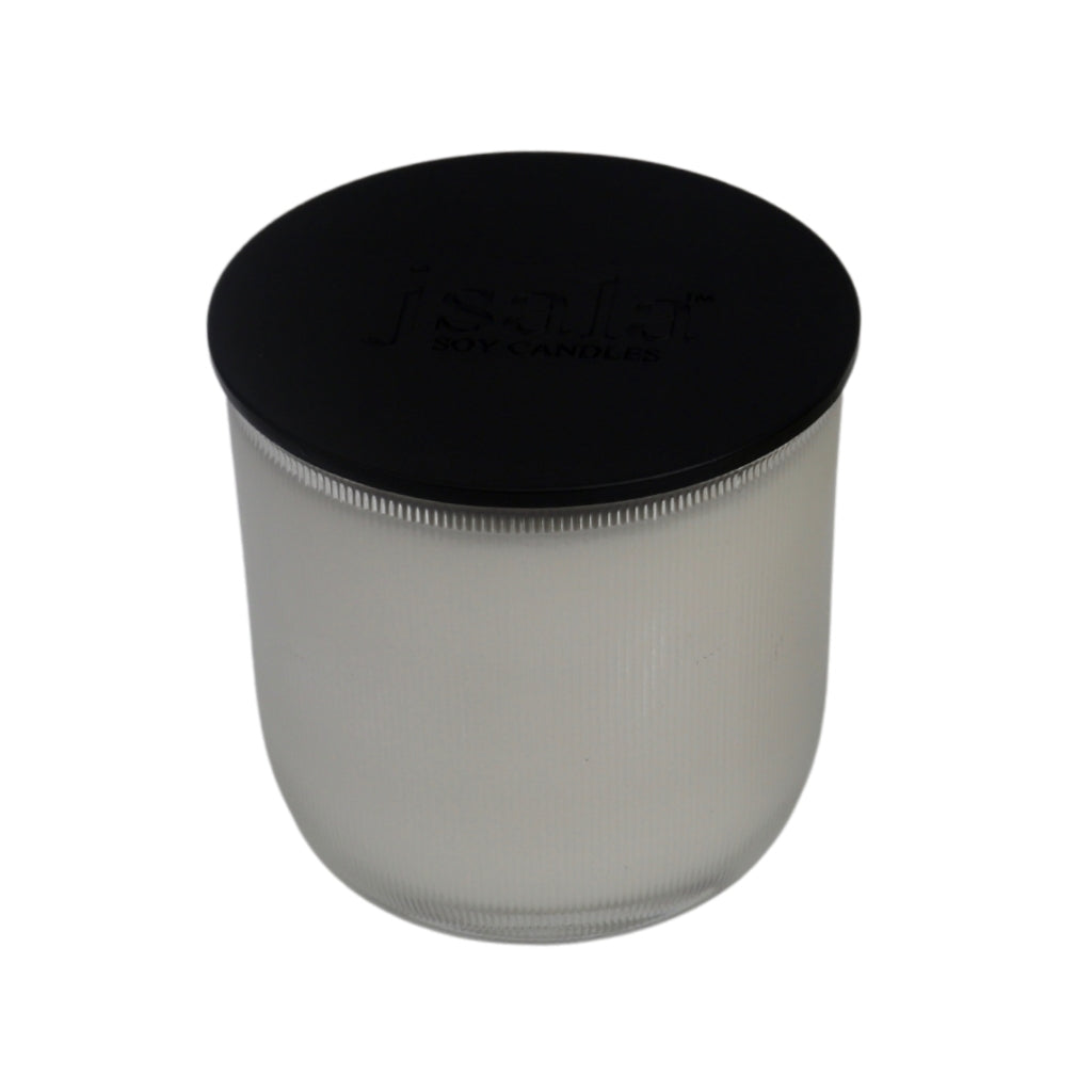 Jsala Ribbed glassware candle with black lid.